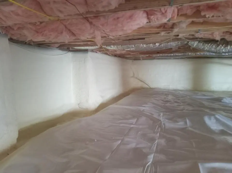 Crawl space encapsulation with closed-cell spray foam for Commercial Roof Restoration in Brownville